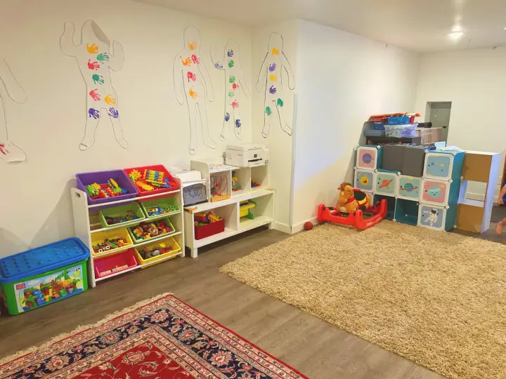 Indoor daycare playroom with toys and activity areas in Lynnwood